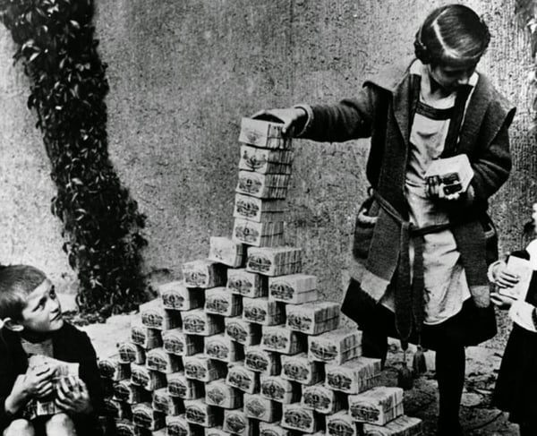 Children playing with stacks of hyperinflated currency during the Weimar Republic, 1922